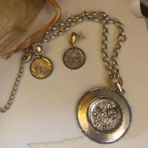 Cool silver and gold tones with crystal accents.